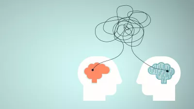 an illustration showing a tangle of lines connecting two brains of different colors